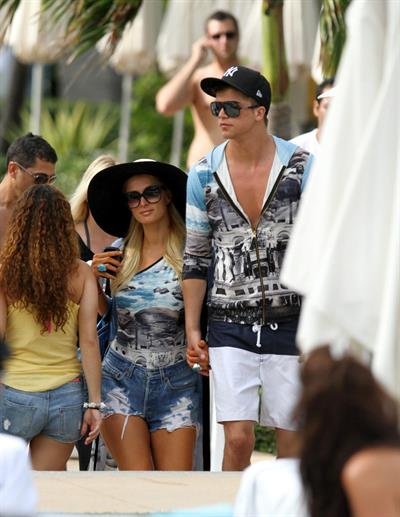 Paris Hilton spends the day in and out of the pool in Miami December 8, 2012