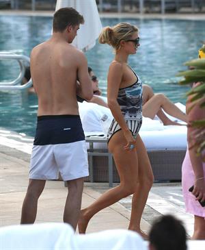 Paris Hilton spends the day in and out of the pool in Miami December 8, 2012
