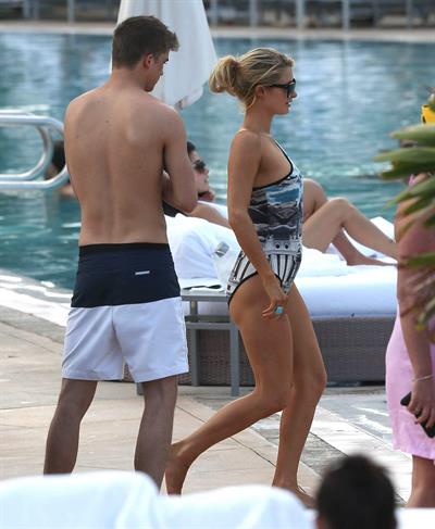 Paris Hilton spends the day in and out of the pool in Miami December 8, 2012