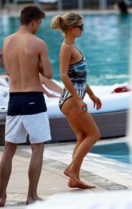 Paris Hilton spends the day in and out of the pool in Miami December 8, 2012