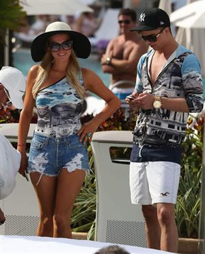 Paris Hilton spends the day in and out of the pool in Miami December 8, 2012