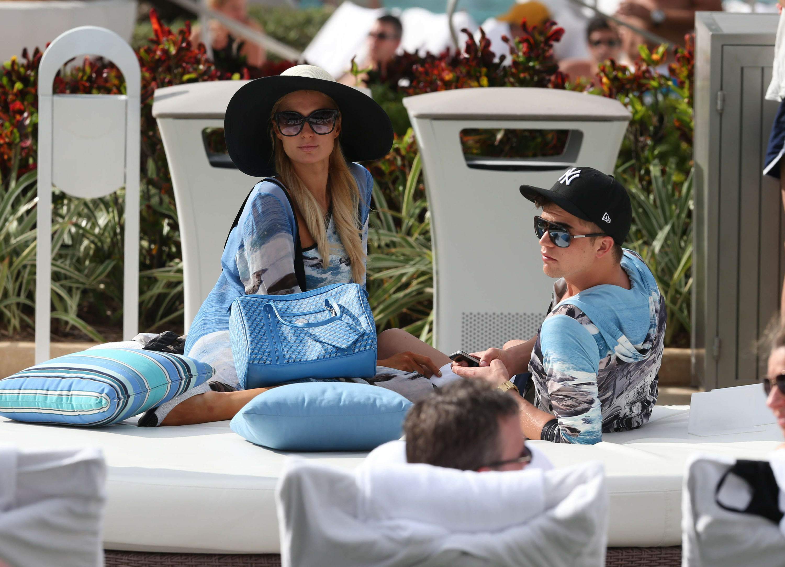 Paris Hilton spends the day in and out of the pool in Miami December 8, 2012