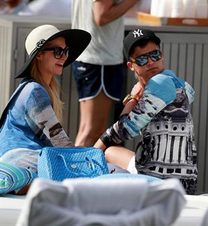 Paris Hilton spends the day in and out of the pool in Miami December 8, 2012