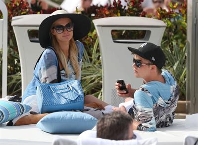 Paris Hilton spends the day in and out of the pool in Miami December 8, 2012
