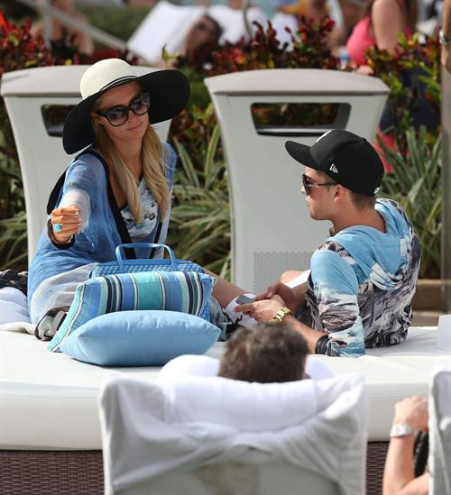 Paris Hilton spends the day in and out of the pool in Miami December 8, 2012