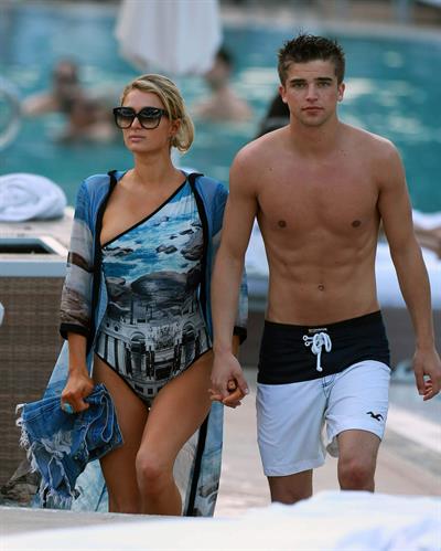 Paris Hilton spends the day in and out of the pool in Miami December 8, 2012