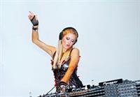 Paris Hilton walks for designer duo Shane and Falguni Peacock and performs as a DJ at the India Resort Fashion Week