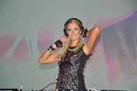 Paris Hilton walks for designer duo Shane and Falguni Peacock and performs as a DJ at the India Resort Fashion Week