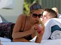 Paris Hilton poolside at their Miami hotel December 7-2012 