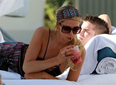 Paris Hilton poolside at their Miami hotel December 7-2012 