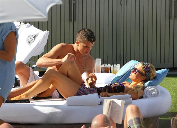 Paris Hilton poolside at their Miami hotel December 7-2012 