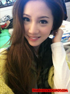 Lin Cai Ti taking a selfie