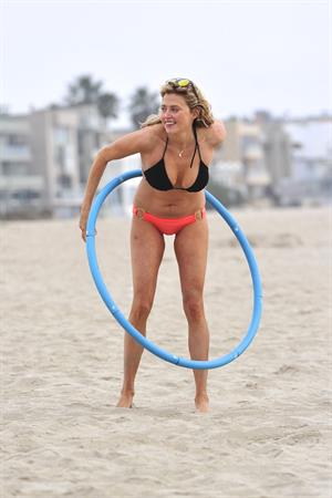 Estella Warren in a bikini with a hula hoop in Venice Beach on August 12, 2014