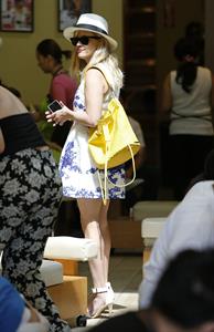 Reese Witherspoon talking and walking after leaving a hair salon in Beverly Hills on August 8, 2014