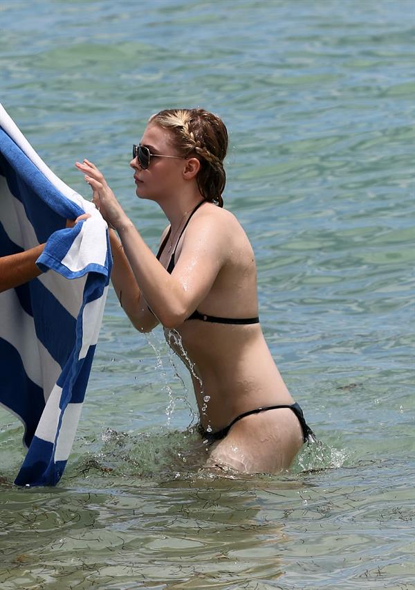 Chloe Grace Moretz candids in a Black Bikini in Miami Beach