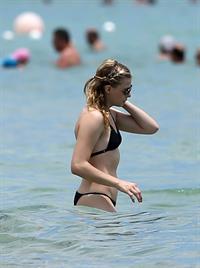 Chloe Grace Moretz candids in a Black Bikini in Miami Beach
