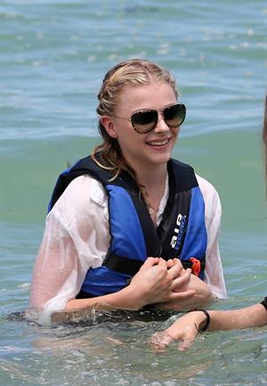 Chloe Grace Moretz candids in a Black Bikini in Miami Beach