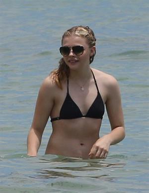 Chloe Grace Moretz candids in a Black Bikini in Miami Beach
