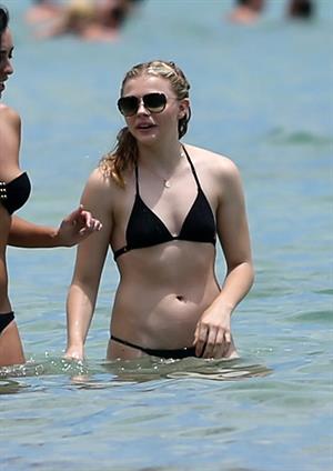 Chloe Grace Moretz candids in a Black Bikini in Miami Beach