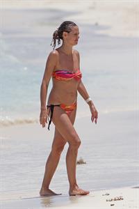 Heidi Klum wearing a bikini on a beach in the Bahamas on July 6, 2013