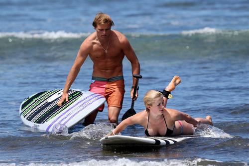 Ireland Baldwin goes paddle-boarding in Hawaii with her boyfriend Slater Trout May 26, 2013 