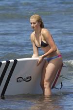 Ireland Baldwin goes paddle-boarding in Hawaii with her boyfriend Slater Trout May 26, 2013 