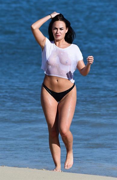 Hayley Fanshaw in a see through top on a beach in Spain