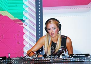 Paris Hilton walks for designer duo Shane and Falguni Peacock and performs as a DJ at the India Resort Fashion Week