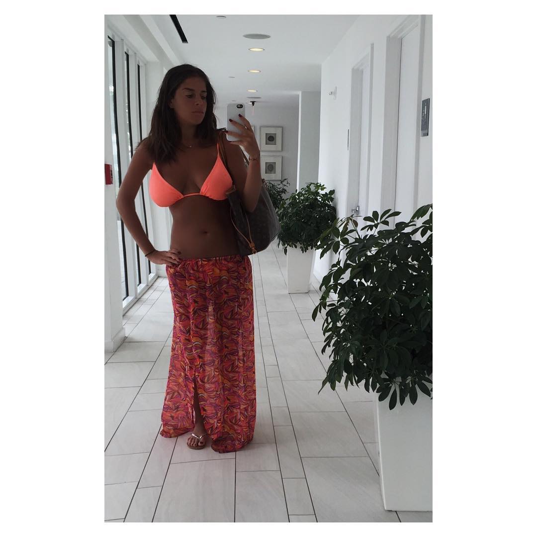 Laura in a bikini taking a selfie