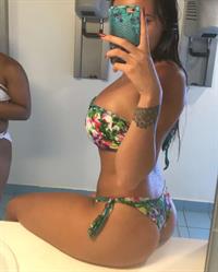 Astrid Nelsia in a bikini taking a selfie