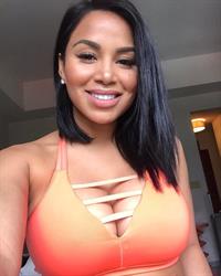 Dolly Castro in a bikini taking a selfie