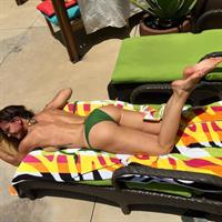 Charisma Carpenter in a bikini - ass