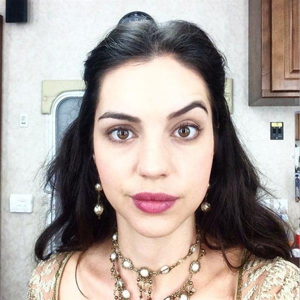 Adelaide Kane taking a selfie