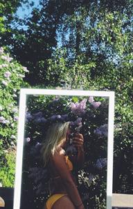 stina jonsson in a bikini taking a selfie