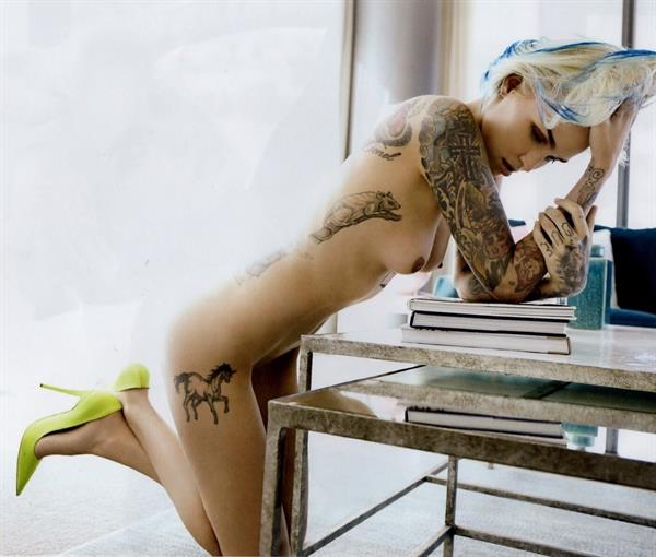 Ruby Rose nude photo shoots showing her naked tattooed body and boobs.











