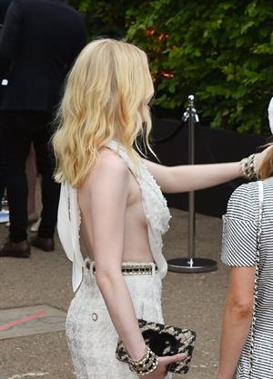 Ellie Bamber braless boobs while wearing basically a scarf as a top showing side boob cleavage.








