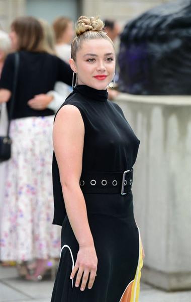 Florence Pugh braless tits pokies in a black dress.
















