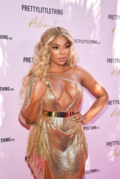 Ashanti sexy cleavage in a low cut dress at the PrettyLittleThings launch party.

