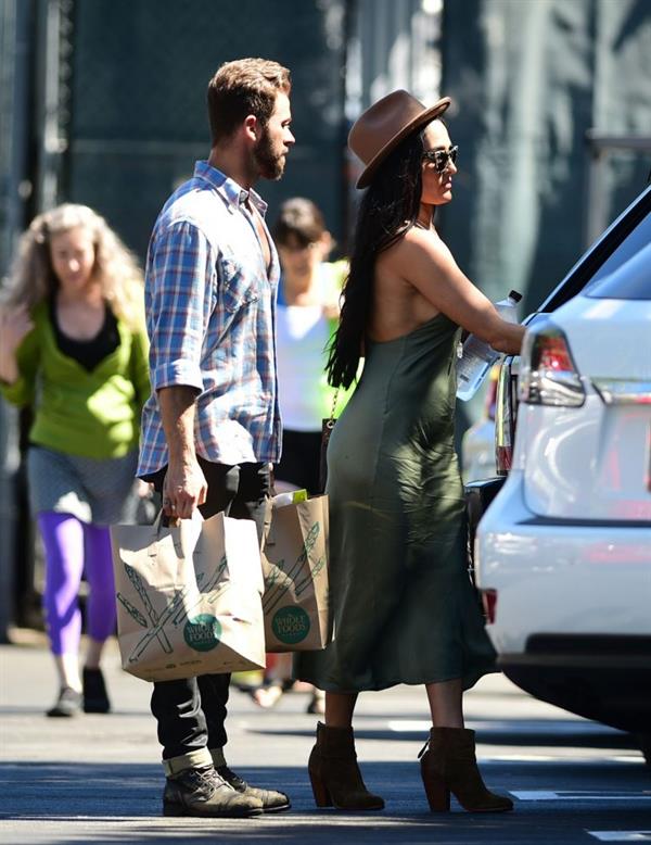 Nikki Bella braless boobs in a green dress seen by paparazzi.
















