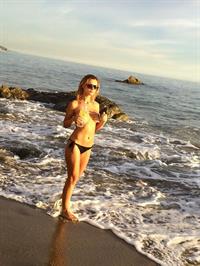 Ella Rose in a topless beach photoshoot