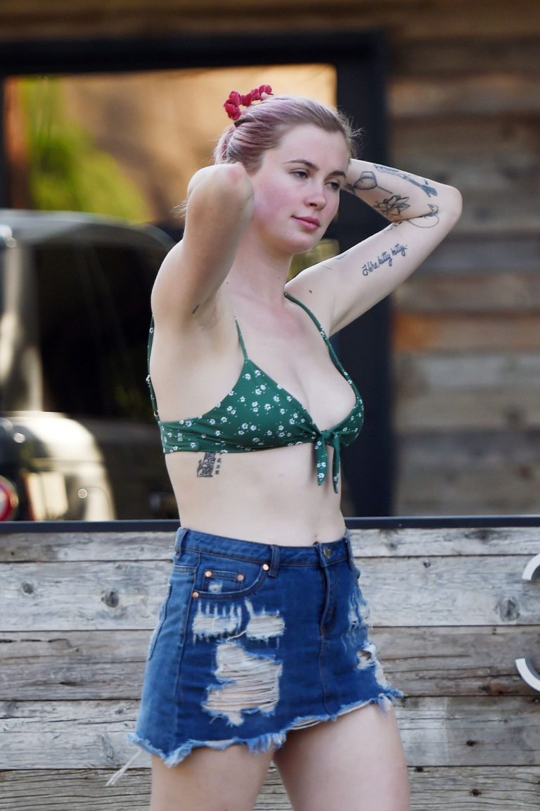 Ireland Baldwin Pictures Ireland Baldwin sexy in a bikini top seen by paparazzi showing some nice cleavage.