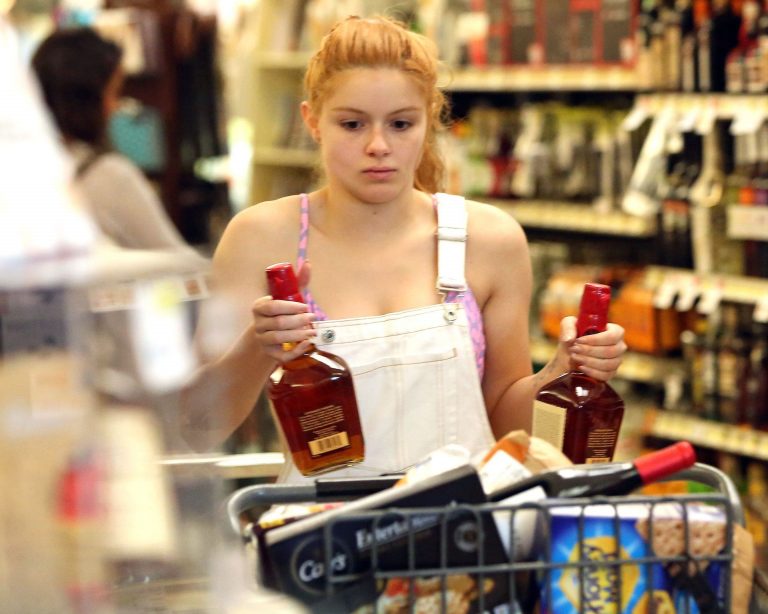 Ariel Winter Pictures Ariel Winter areola peek in a sexy bikini top seen by paparazzi buying liquor.