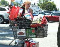 Ariel Winter areola peek in a sexy bikini top seen by paparazzi buying liquor.









