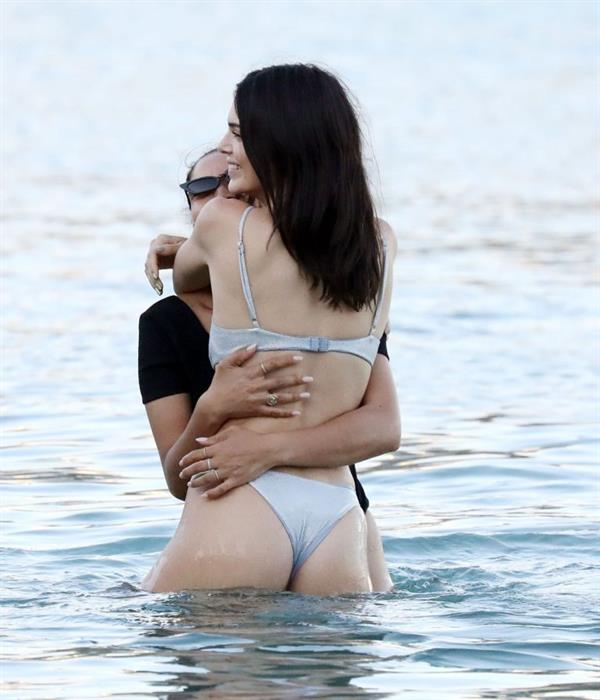 Kendall Jenner sexy ass in a thong bikini seen by paparazzi in the water at the beach.




























