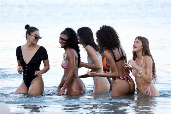 Kendall Jenner sexy ass in a thong bikini seen by paparazzi in the water at the beach.




























