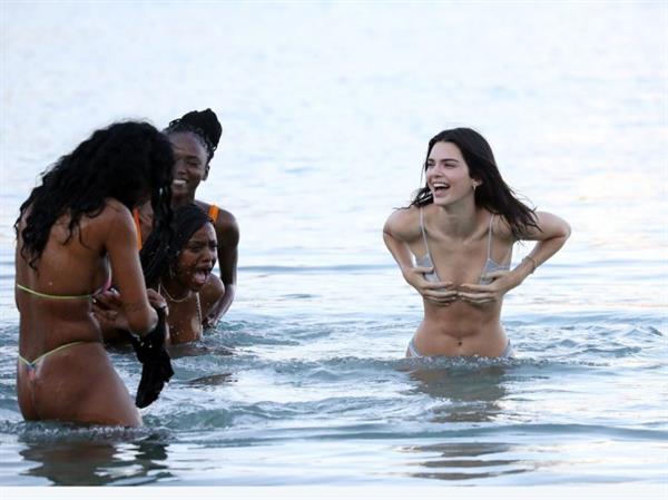 Kendall Jenner sexy ass in a thong bikini seen by paparazzi in the water at the beach.




























