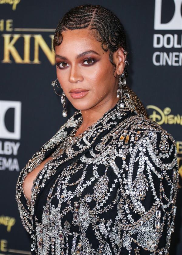 Beyonce braless boobs and areola peek showing off nice cleavage on the red carpet for the premiere of  The Lion King .






