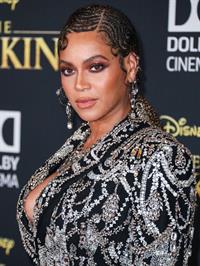 Beyonce braless boobs and areola peek showing off nice cleavage on the red carpet for the premiere of  The Lion King .






