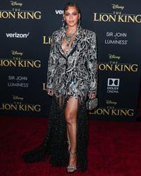 Beyonce braless boobs and areola peek showing off nice cleavage on the red carpet for the premiere of  The Lion King .






