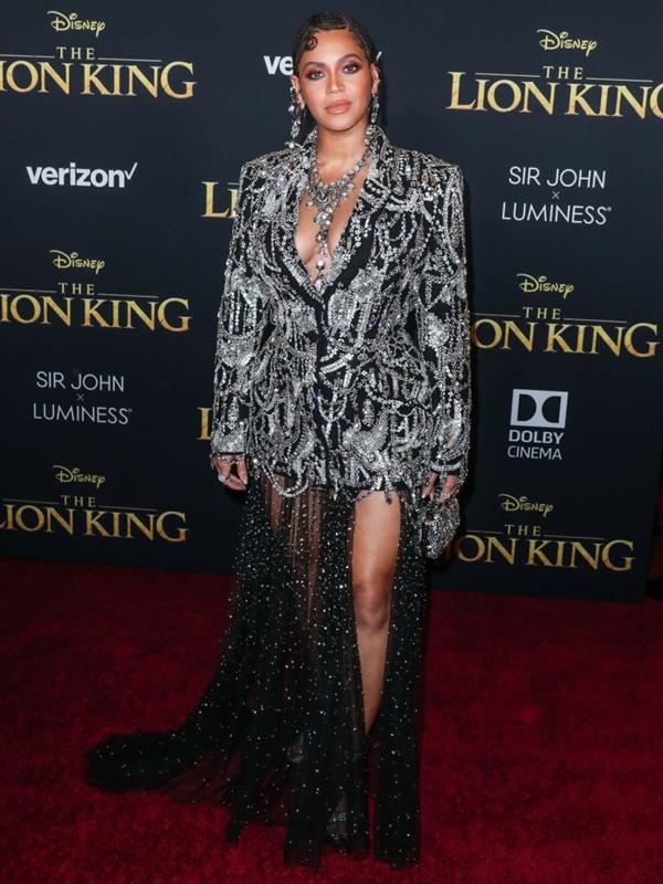 Beyonce braless boobs and areola peek showing off nice cleavage on the red carpet for the premiere of  The Lion King .






